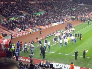 The players enter the field, already wishing they could leave Stoke